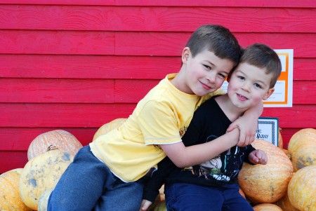 Boys at the pumpkin patch, an annual photo tradition.